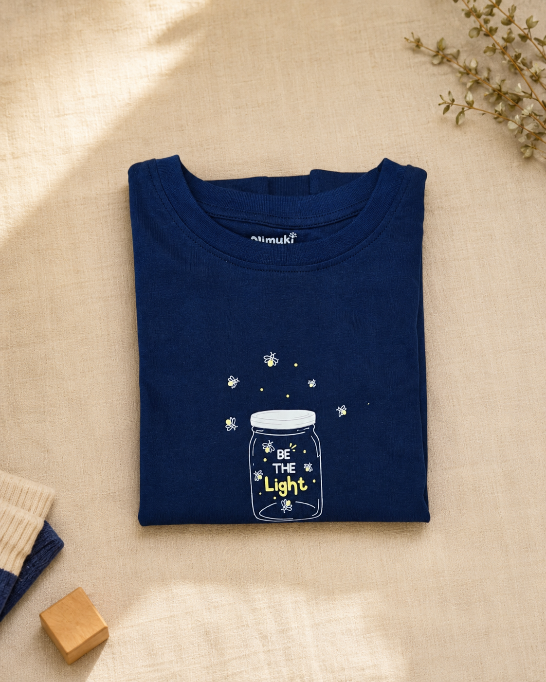 Catch the Light navy blue kids graphic t-shirt, folded flat lay showing fabric detail