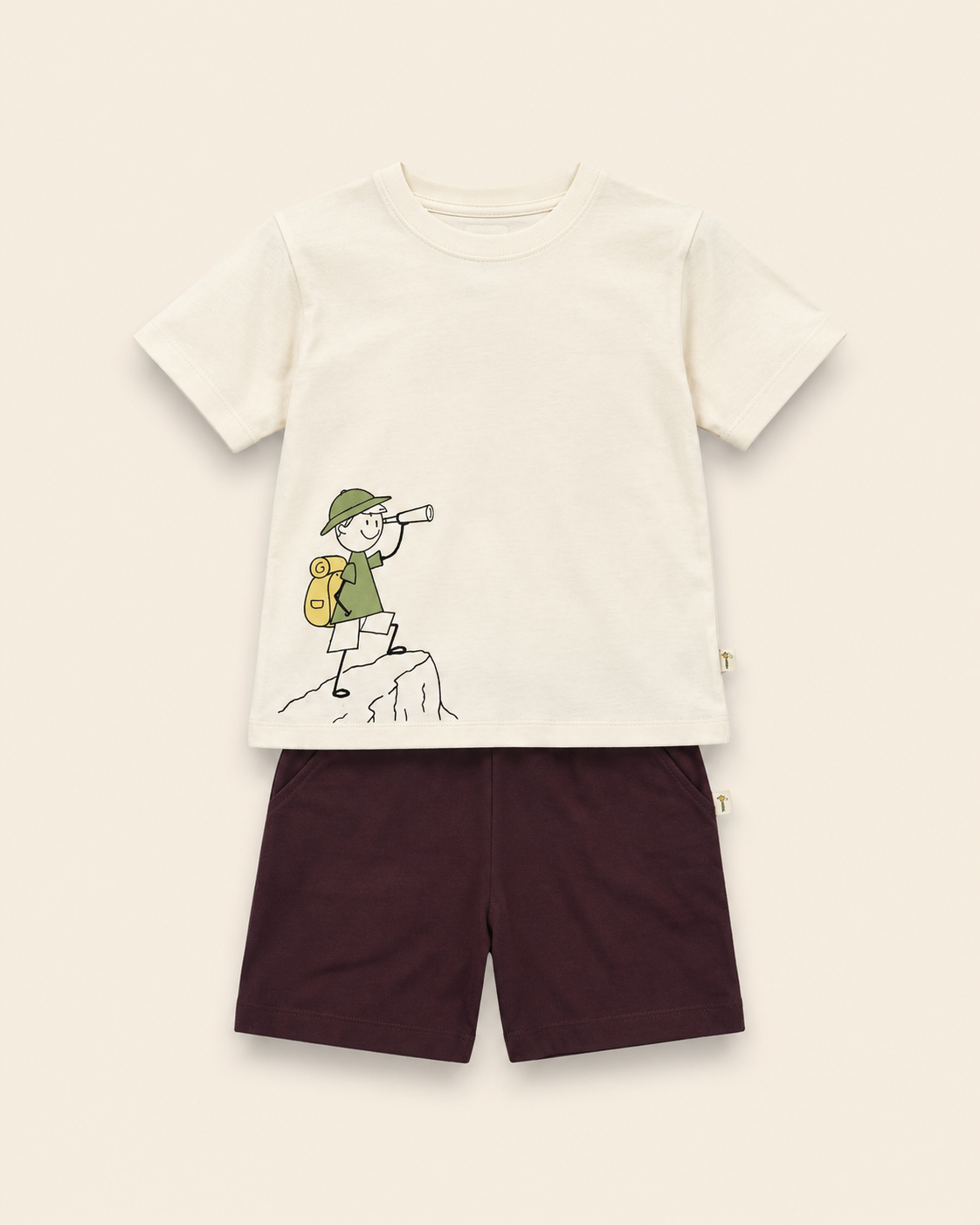 Cream Little Explorer kids coord set with coffee brown shorts, laid flat front view