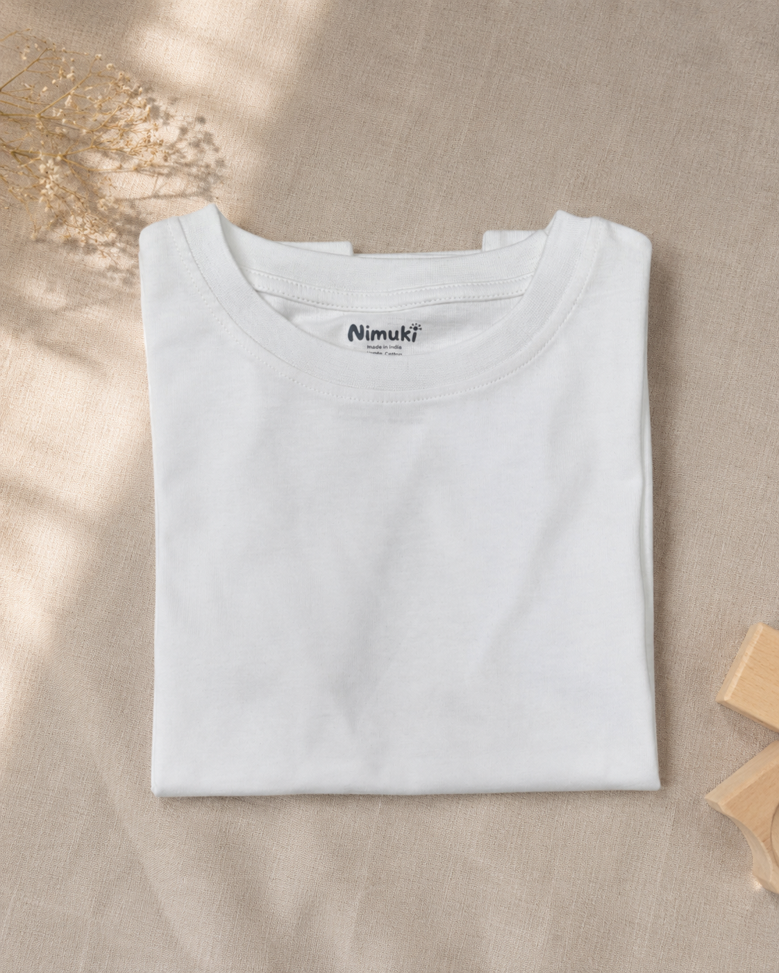 Little Adventure Trail white kids graphic t-shirt, folded flat lay showing fabric detail