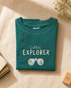 Little Explorer Binoculars aqua green kids graphic t-shirt, folded flat lay showing fabric detail