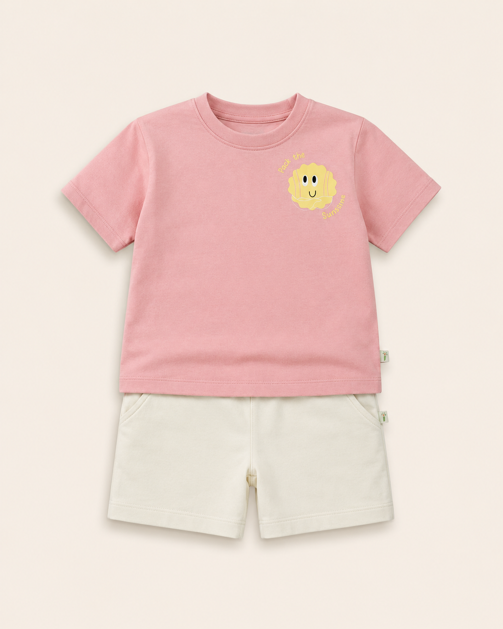 Peach Pocket Sunshine kids coord set with cream shorts, laid flat front view