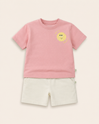 Peach Pocket Sunshine kids coord set with cream shorts, laid flat front view