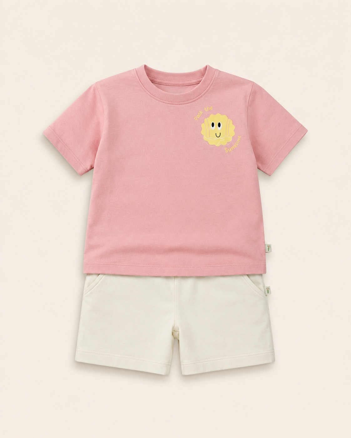 Peach Pocket Sunshine kids coord set with cream shorts, laid flat front view