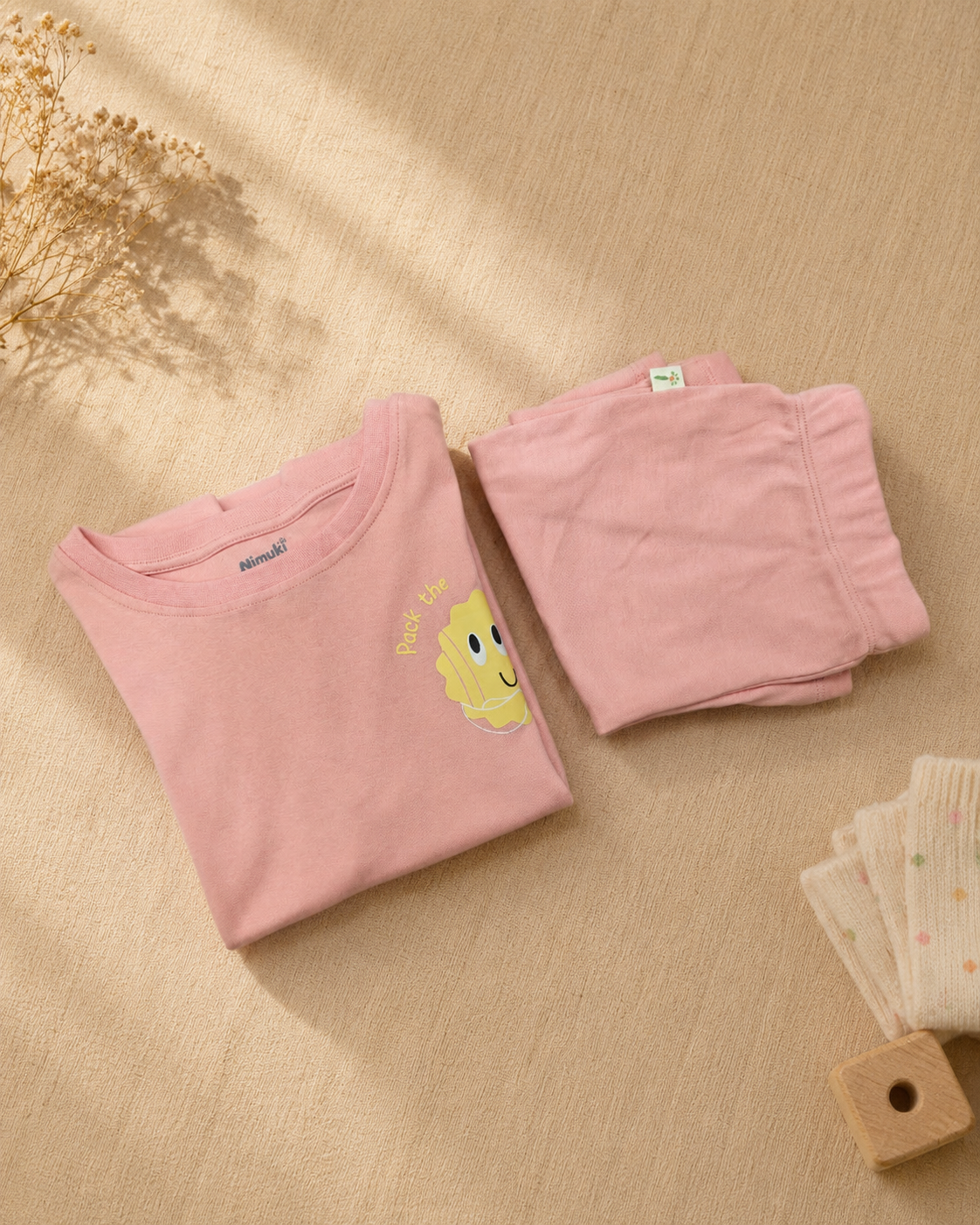 Peach Pocket Sunshine kids coord set, folded flat lay showing fabric detail