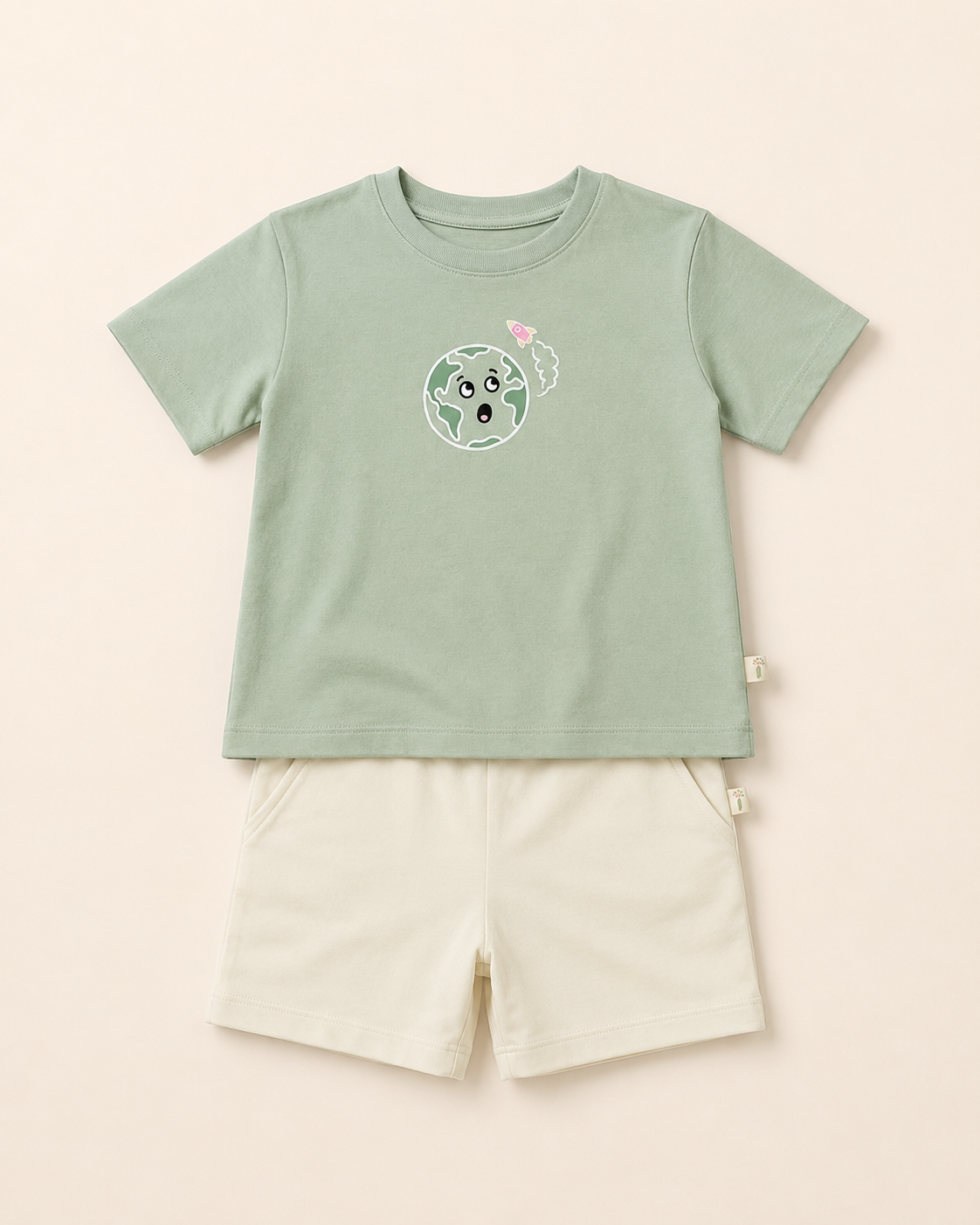 Sage Green Planet Explorer kids coord set with cream shorts, laid flat front view
