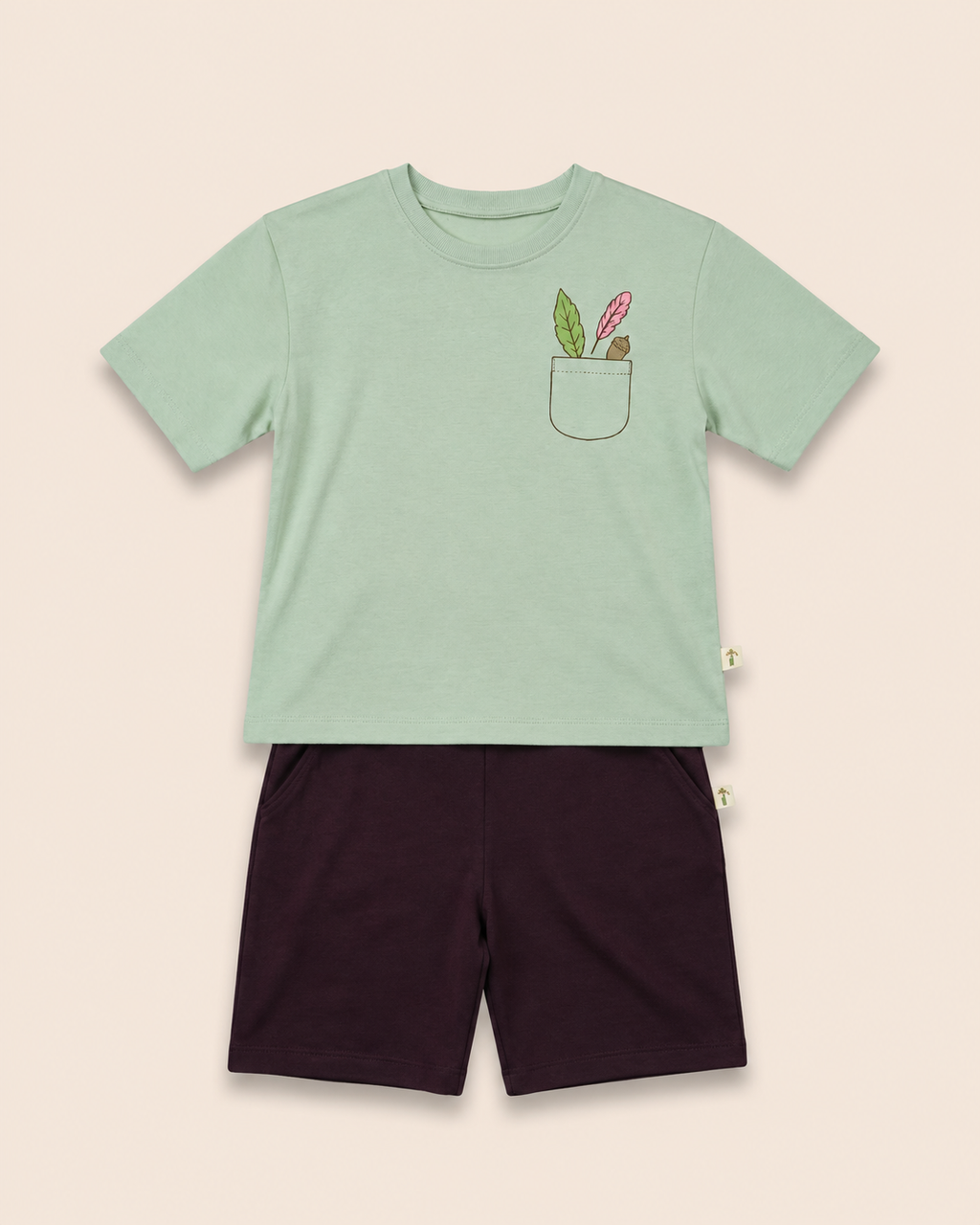 Sage Green Pocket Discovery kids coord set with coffee brown shorts, laid flat front view