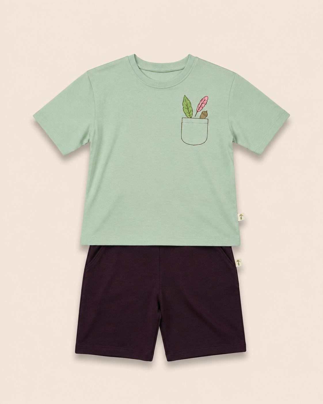 Sage Green Pocket Discovery kids coord set with coffee brown shorts, laid flat front view
