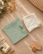 Sage Green Pocket Discovery kids coord set with cream shorts, folded flat lay showing fabric detail