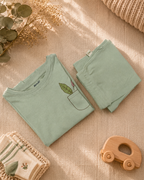Sage Green Pocket Discovery kids coord set, folded flat lay showing fabric detail