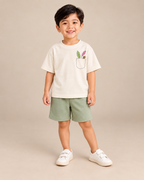 Cream Pocket Discovery Kids Coord Set with Sage Green Shorts — Model shot